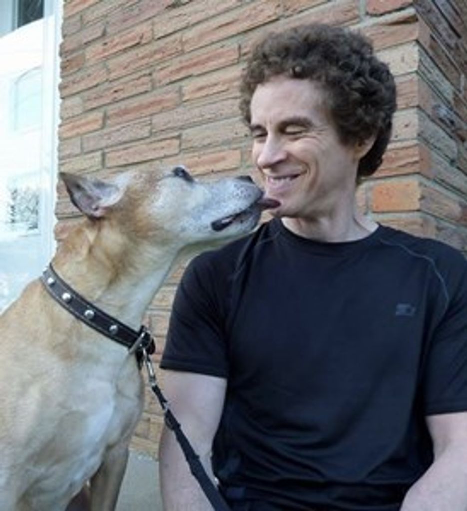 Lary smiling with his beloved dog Champ